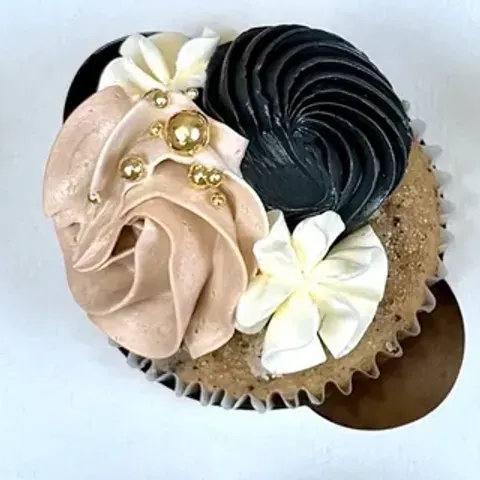 Cupcake detail: blush and black buttercream swirls with gold pearls